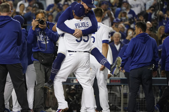 The Los Angeles Dodgers celebrate after Chris Taylor hit a home run during the ninth inning to win a National League Wild Card playoff baseball game 3-1 over the St. Louis Cardinals Wednesday, Oct. 6, 2021, in Los Angeles. Cody Bellinger also scored.