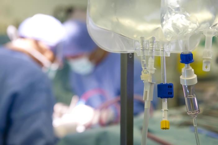 Surgeons remove the liver and kidneys of a deceased donor, for later transplantation.