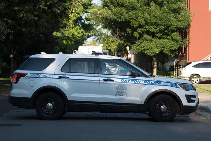 A Dayton Police vehicle is viewed after an active shooter opened fire in the Oregon district in Dayton, Ohio on August 4, 2019.