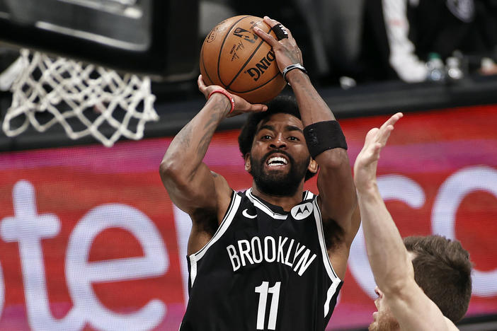 Brooklyn Nets guard Kyrie Irving shoots against the Milwaukee Bucks during Game 1 of an NBA basketball second-round playoff series in New York in June.