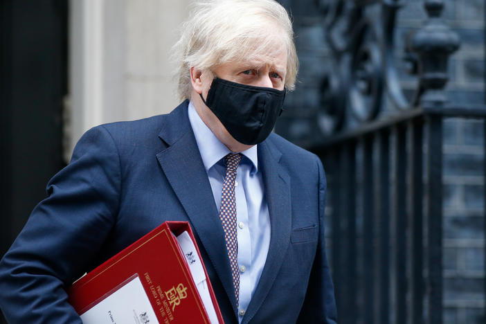 A mask-clad U.K. Prime Minister Boris Johnson departs from No. 10 Downing St. in London in March.