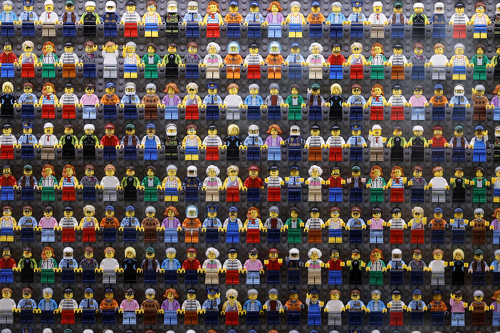 A wall of Lego minifigures is encased inside the lobby of the Legoland Hotel in Goshen, N.Y. on Aug. 6. The Danish company is pledging to remove harmful stereotypes from its products and marketing.