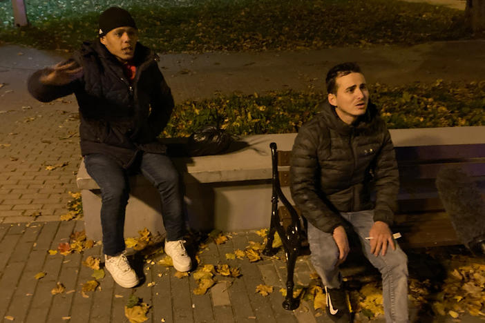 Raydel Aparicio Bringa (left) and Doniel Machado Pujol are photographed while being apprehended by Poland's Border Guard in the town of Sokolka, on the Polish border with Belarus. The two men, from Cuba, are among thousands of migrants from impoverished or war-torn countries that the regime of Alexander Lukashenko is accused of luring to Belarus to be sent across the border into the EU.