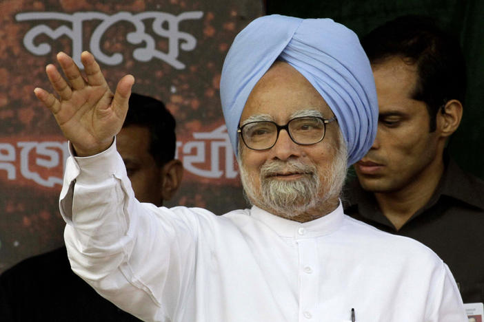 Indian Prime Minister Manmohan Singh waves to a crowd in Kolkata, India, in 2011.