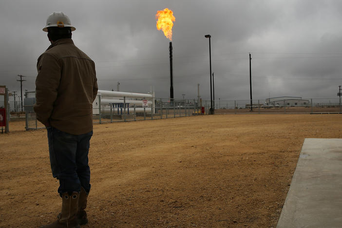 Flared natural gas is burned off at Apache Corporation's operations at the Deadwood natural gas plant in Garden City, Texas, on Feb. 5, 2015.