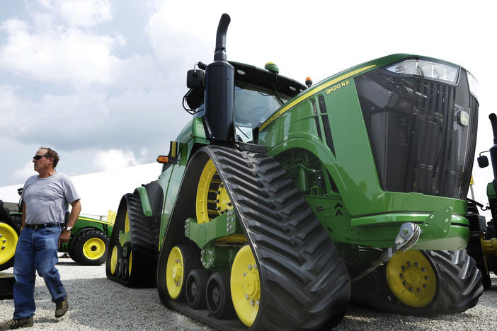 John Deere is known for its signature green and yellow farm equipment, like this equipment on display in 2015 at the Farm Progress Show in Decatur, Ill.