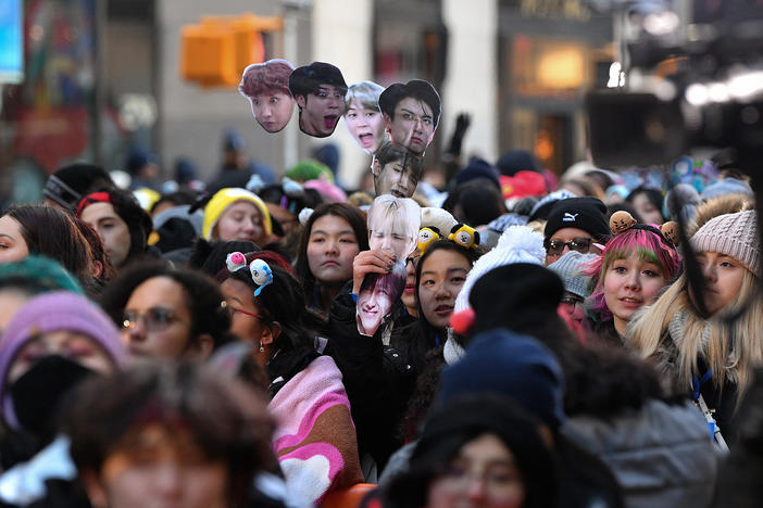 Fans await the K-pop boy band BTS visit to the <em>Today</em> show at Rockefeller Plaza in New York City last year.