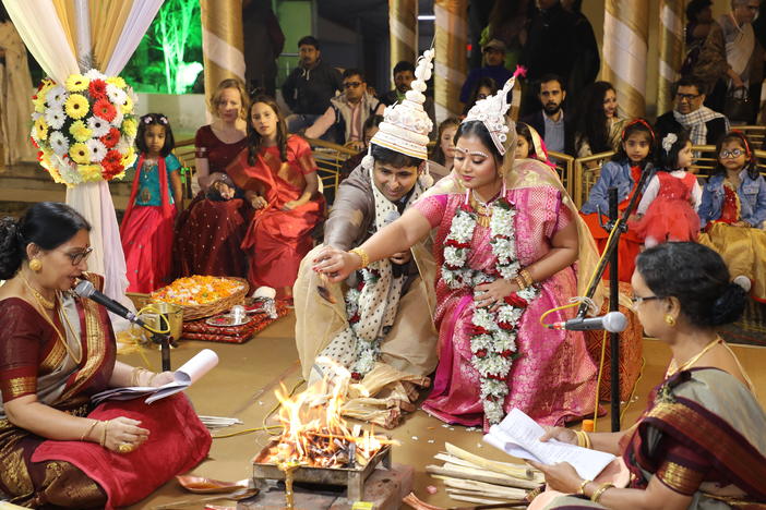 Sharmistha Chaudhuri (center, wearing pink), 35, at her wedding in Kolkata, India, in January 2020. Chaudhuri found some Indian wedding traditions retrograde, so she hired four feminist priestesses to officiate at hers. They performed a multilingual, egalitarian ceremony stripped of patriarchal traditions.