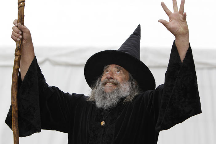 The Wizard of New Zealand, also known as Ian Brackenbury Channell, casts a "spell" during a television interview in Christchurch, New Zealand, in March 2011. His contract with the city will end in December after more than two decades.