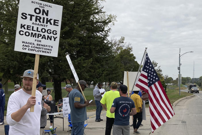 Workers from a Kellogg cereal plant picket along the main rail lines leading into the facility on Oct. 6 in Omaha, Neb. Workers have gone on strike after a breakdown in contract talks with company management.