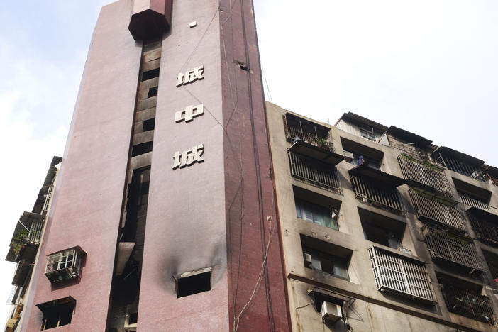 A burnt building is pictured in Kaohsiung in southern Taiwan on Friday. Dozens were killed and dozens more injured after a fire broke out early Thursday in a decades-old mixed commercial and residential building in the Taiwanese port city of Kaohsiung, officials said.