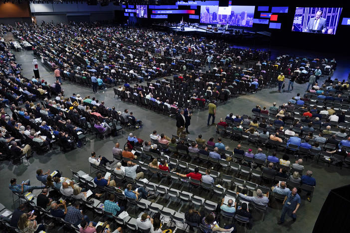 In this June 16, 2021, file photo, people attend the morning session of the Southern Baptist Convention annual meeting in Nashville, Tenn.