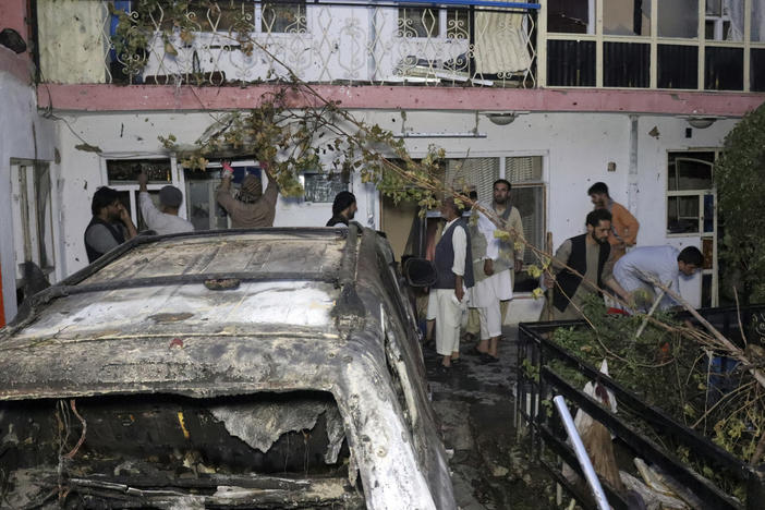 Afghans inspect damage of the Ahmadi family house after a U.S. drone strike in Kabul, Afghanistan, on Aug. 29. The strike, which the Pentagon originally deemed a success in striking an ISIS-K target, killed 10 civilians, none of whom were associated with the terrorist group.