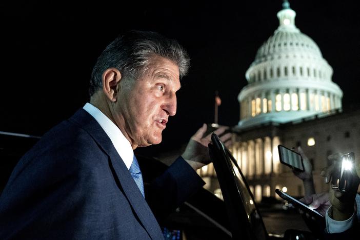 Sen. Joe Manchin, a Democrat from West Virginia, speaks to members of the media while departing the U.S. Capitol on Oct. 7. Manchin has reportedly told the White House that he opposes the key climate measure in Biden's multitrillion-dollar climate and social programs package.