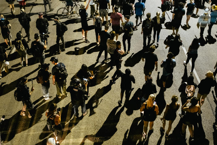 Demonstrators march in the streets on August 26, 2020 in Kenosha, Wisconsin. As the city declared a state of emergency curfew, a fourth night of civil unrest occurred after the shooting of Jacob Blake, 29, on August 23.