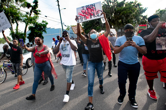 Demonstrators march on June 4, 2020 in Brunswick, Ga., after a court appearance by Gregory and Travis McMichael, two suspects in the fatal shooting of Ahmaud Arbery.