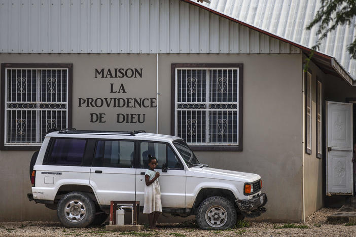 Children stand in the courtyard of the Maison La Providence de Dieu orphanage it Ganthier, Croix-des-Bouquets, Haiti, Sunday, Oct. 17, 2021, where a gang abducted 17 missionaries from a U.S.-based organization. The 400 Mawozo gang, notorious for brazen kidnappings and killings took the group of 16 U.S. citizens and one Canadian, after a trip to visit the orphanage.