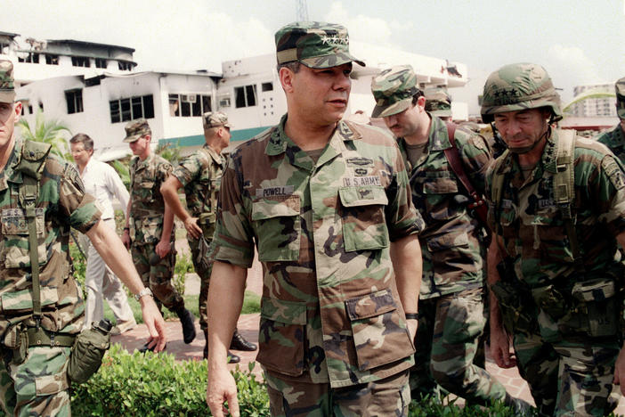 Gen. Colin Powell, head of the Joint Chiefs of Staff, tours the bombed courtyard of the Panamanian Defense Force Comandancia in Panama City during the U.S. invasion of Panama on Jan. 5, 1990.