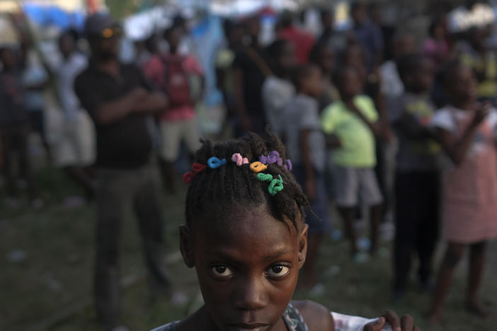 A girl waits with other earthquake victims for the start of a food distribution in Les Cayes, Haiti, in August, a week after a 7.2 magnitude earthquake hit the area.