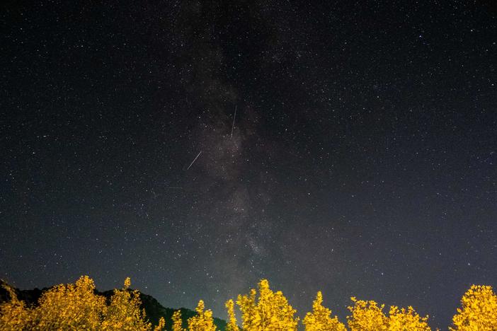 Meteors from the Orionid meteor shower streak as they cross through the Milky Way in the mountainous area of Tannourine in northern Lebanon, on October 3, 2021.