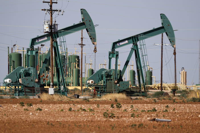 In this July 29, 2020 file photo, a view of a pump jack operating in an oil field in Midland, Texas.