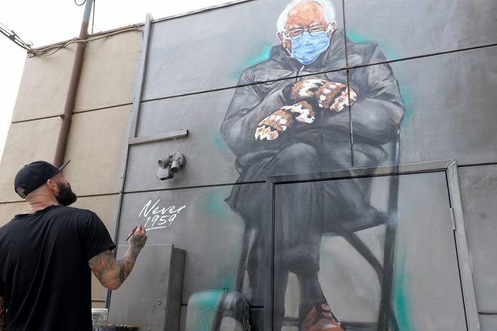 Artist Jonas Never (@never1959) applies finishing touches to his mural of Sen. Bernie Sanders in Culver City, Calif., on Jan. 24. Standing out in a crowd of glamorously dressed guests, Sanders showed up for the presidential inauguration in a heavy winter jacket and patterned mittens — with an AFP photo of the veteran leftist spawning the first viral meme of the Biden era.