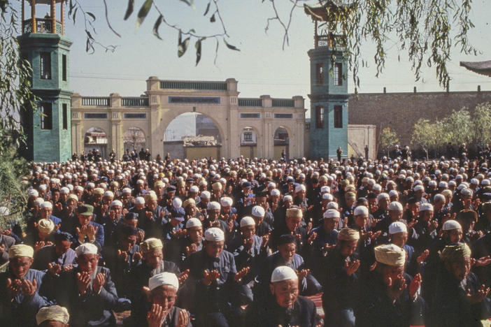 Xining's Dongguan Mosque has been a source of community for Chinese Muslims for seven centuries. Here, Hui Muslim men pray in the mosque in 1983.