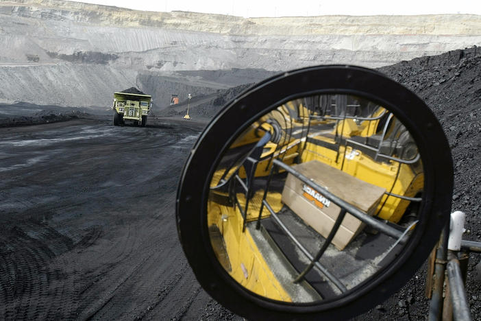 A coal-hauling truck with 240 tons of coal drives to the surface at the Buckskin Coal Mine in Gillette, Wyo., in 2004.