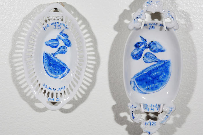 Plates depicting what two juveniles on Death Row ate for their final meals, painted by artist Julie Green.