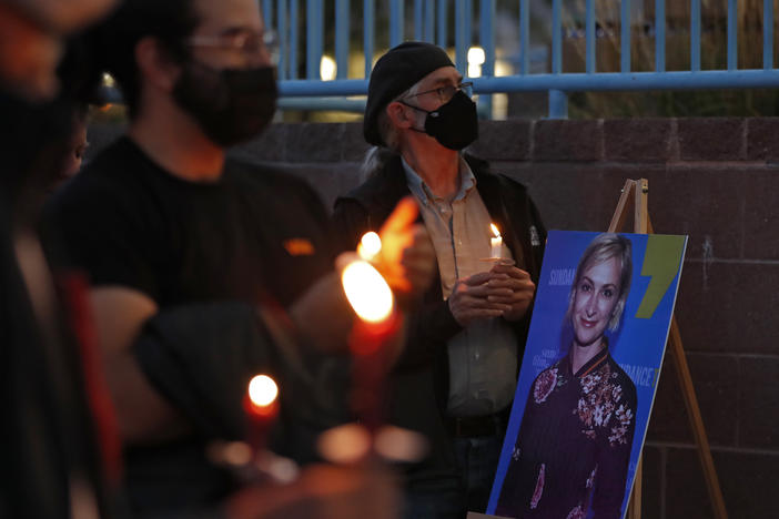 New Mexico residents attend a candlelight vigil to honor cinematographer Halyna Hutchins in Albuquerque, N.M. Saturday, Oct. 23, 2021. Hutchins was fatally shot on Thursday on the set of a Western filmed in Santa Fe, N.M.