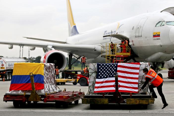 Containers of Moderna COVID-19 vaccine doses, donated by the United States, arrive in Bogota, Colombia, in July. The U.S. plans to send more than a billion vaccines abroad by September 2022.