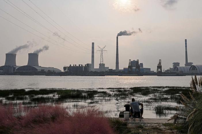 Scientists warn the world needs to dramatically reduce fossil fuel use, but many countries still depend on coal power, like from the Wujing Coal-Electricity Power Station in Shanghai, China.