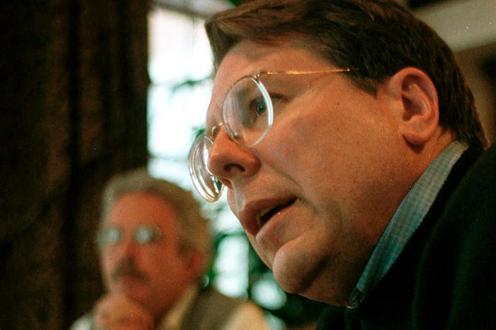 Charlton Heston (left), then president of the NRA, meets with fellow leaders Wayne LaPierre (far right) and Jim Baker (center) on April 30, 1999, ahead of the NRA's annual meeting in Denver. Around the same time, leaders discussed how to respond to the shooting at Columbine High School in nearby Littleton, Colo. More than 20 years later, NPR has obtained secret recordings of those conversations.