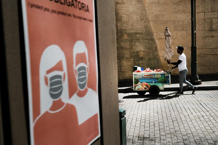 A vendor walks through Old San Juan, Puerto Rico, in March.
