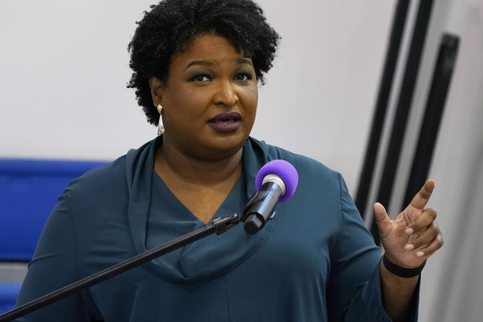Stacey Abrams speaks during a church service in Norfolk, Va., on Oct. 17. A political organization led by the Democrat is branching out into paying off medical debts. Fair Fight Action said it's donating $1.34 million from its political action committee to wipe out debt owed by 108,000 people in Georgia, Arizona, Louisiana, Mississippi and Alabama.