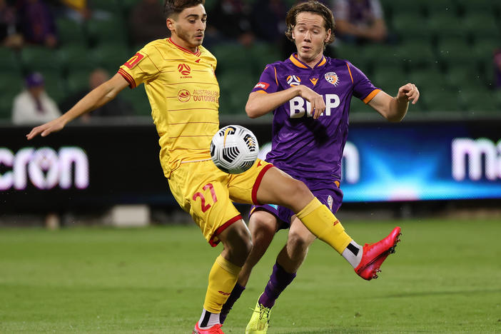 Josh Cavallo of Adelaide, left, and Daniel Stynes of the Glory contest for the ball during the A-League match between Perth Glory and Adelaide United at HBF Park, on May 19 in Perth, Australia.