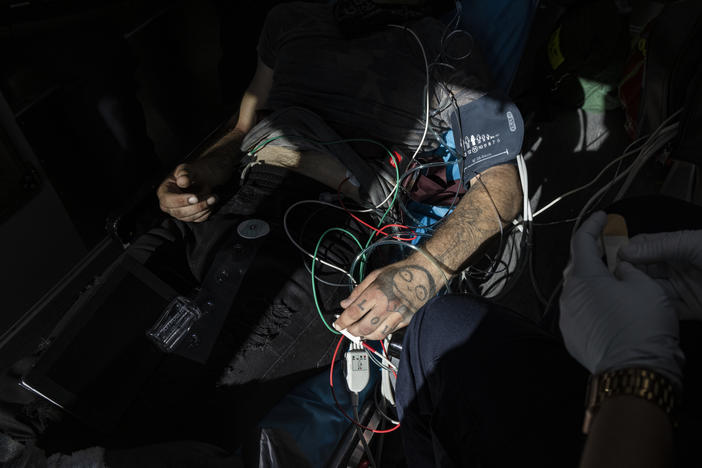 A man gets care in an ambulance after overdosing in San Francisco, California.