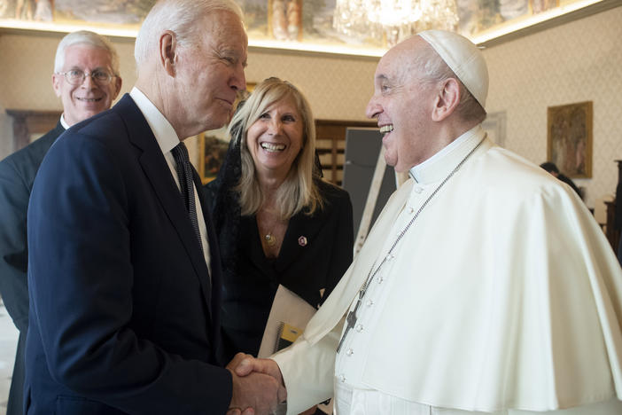 President Biden shakes hands with Pope Francis at the Vatican on Friday. The pontiff called Biden a good Catholic.