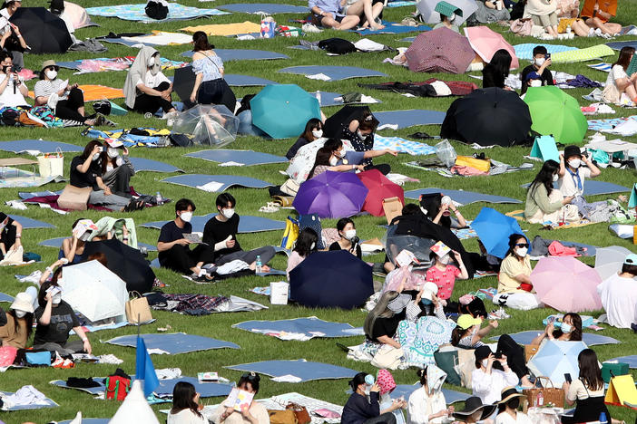Festivalgoers attend a music festival at Olympic Park on June 26, 2021 in Seoul, South Korea.