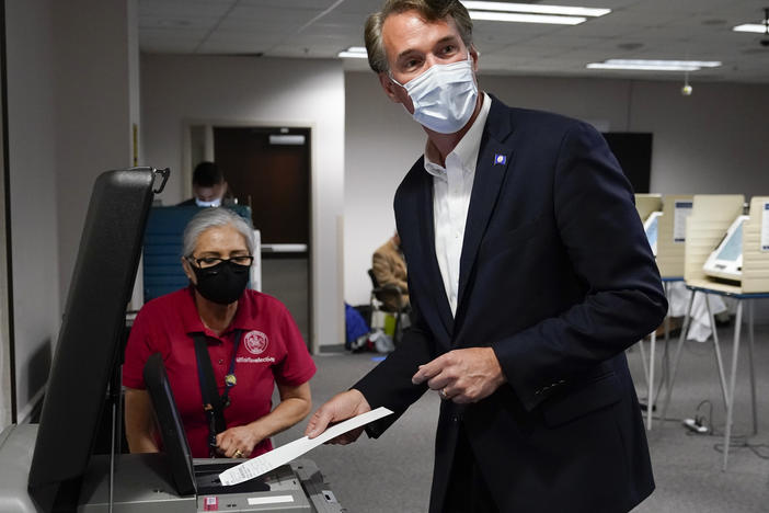 Virginia Republican gubernatorial candidate Glenn Youngkin casts his ballot early, in September. Youngkin has walked a tight rope on voting issues ahead of Tuesday's election.