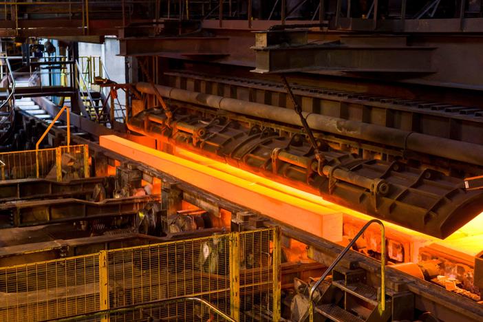 Steel ingots emerge from an oven at the Saarsthal rail plant in Hayange, France, on Sept. 13, 2021. The United States and European Union have reached a deal on steel and aluminum tariffs.