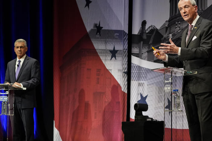 Democratic Gov. Phil Murphy (right) speaks while Republican challenger Jack Ciattarelli listens during a gubernatorial debate at Rowan University last month in Glassboro, N.J.
