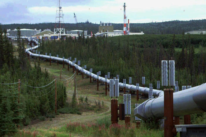 The Biden administration is announcing new and proposed regulations to limit climate-warming methane emissions from oil and gas operations and pipelines. This undated file photo shows the Trans-Alaska pipeline and pump station north of Fairbanks.