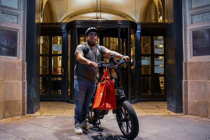 Gustavo Ajche delivers food for DoorDash in Lower Manhattan. Ajche, who has helped organized 3,000 other food delivery workers during the pandemic, was one of the activists who helped get legislation passed to improve working conditions and pay for the couriers, October 15, 2021.