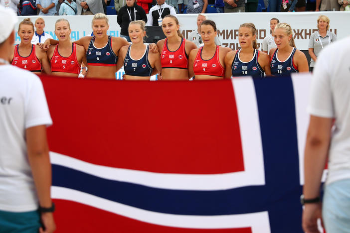 Norway's team lines up during the 2018 Women's Beach Handball World Cup final against Greece in 2018 in Kazan, Russia.