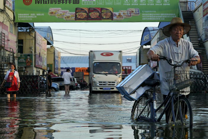 Xinxiang, in China's Henan Province on July 26, was one of many places that suffered extreme flooding this year. A U.N reports finds climate impacts are getting worse faster than countries can adapt.