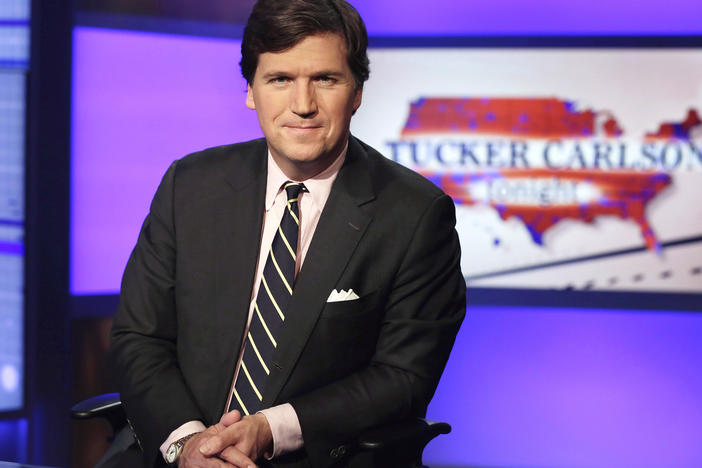 Tucker Carlson, host of "Tucker Carlson Tonight," poses for photos in a Fox News Channel studio, in New York.