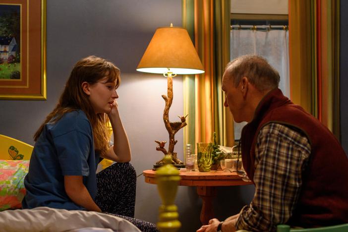 Betsy, played by Kaitlyn Dever, and Dr. Samuel Finnix, Michael Keaton, discuss her first Oxy prescription for back pain from a workplace injury.