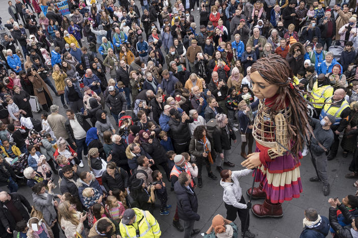 Little Amal delights crowds of onlookers in Coventry, UK, on Oct. 27, 2020.