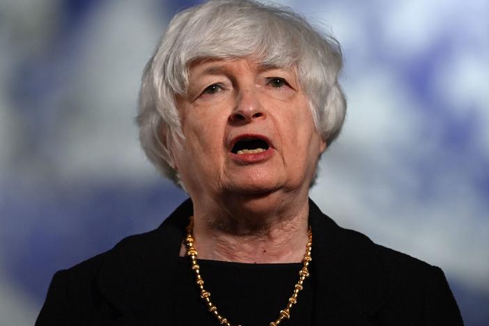 Treasury Secretary Janet Yellen speaks to the press during the COP26 U.N. Climate Summit in Glasgow, Scotland, on Wednesday. In an interview with NPR's <em>Morning Edition</em>, Yellen said she expects inflation will moderate by next year. She also called on the private sector to do more to fight climate change.